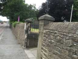 Oblique right side view of Gates and Wall around Yard to Church of St. Helen July 2016